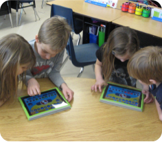 children working with iPads