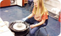 Girl at pottery wheel